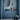 Bathroom with blue geometric tiles, sink, and decorative items like vases and flowers.